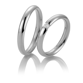 Breuning vielsesringe i 9-14 kt hvidguld med blank overflade, buet profil og 0,08 ct brillant