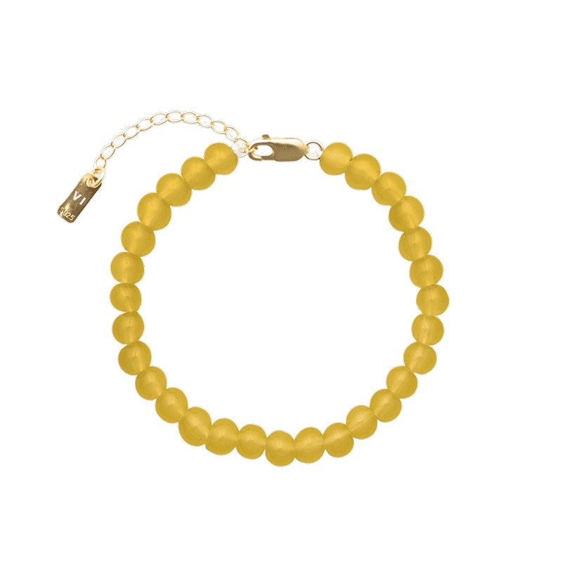 Det smukke Candy Coral Honey armbånd fra House of Vincent